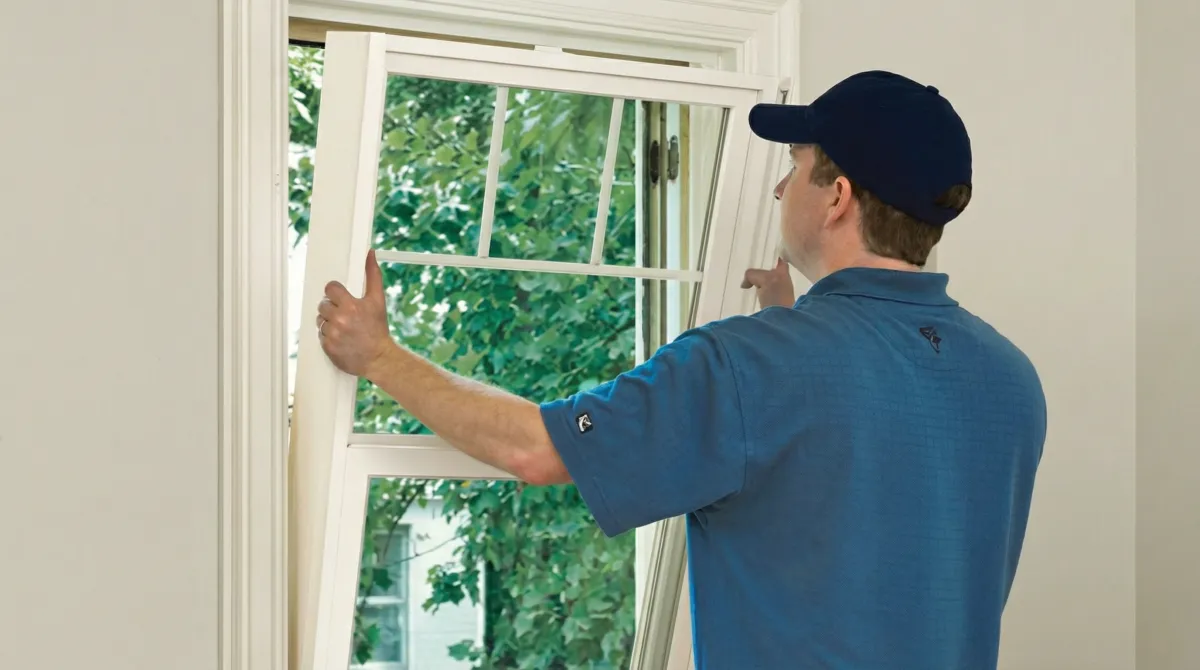 Professional contractors performing a residential window insulation and replacement service in Madison, WI